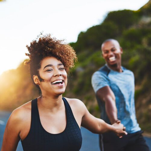 san diego naturopathic doctors couple laughing holding hands on road