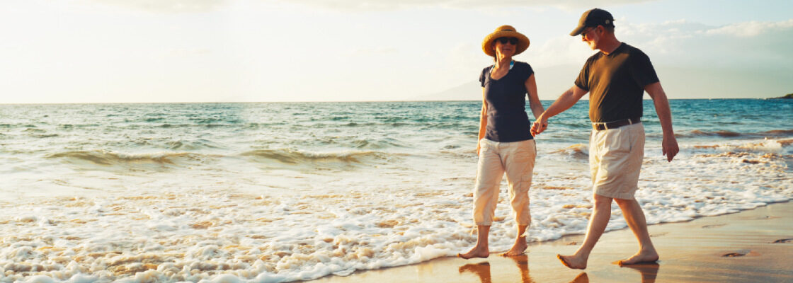 san diego naturopathic doctors elderly couple walking on beach holding hands