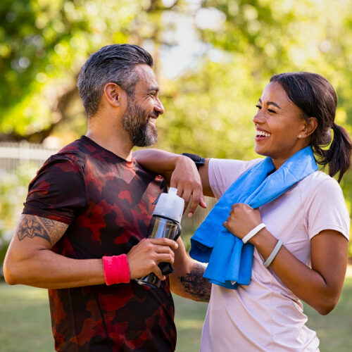 san diego naturopathic doctors man and woman exercising laughing in park