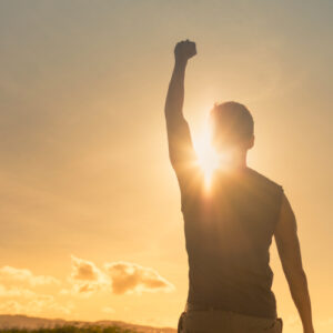 san diego naturopathic doctors man cheering with arm facing sun set