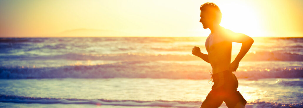 san diego naturopathic doctors man jogging on beach sunset in background