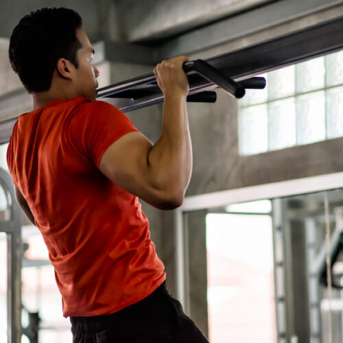 san diego naturopathic doctors man performing pull up in gym