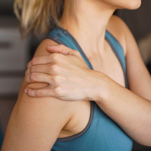 san diego naturopathic doctors woman holding shoulder joint in pain