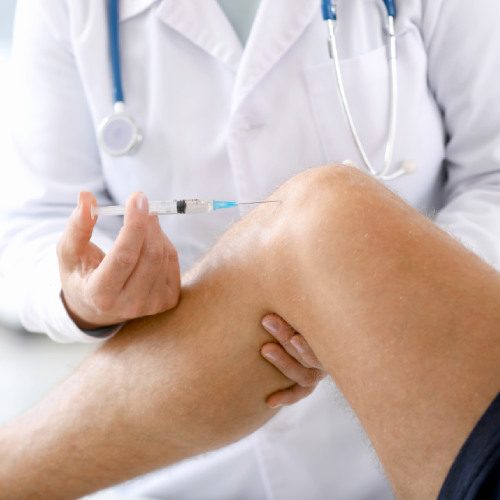 san diego naturopathic doctors healthcare worker injecting knee of patient